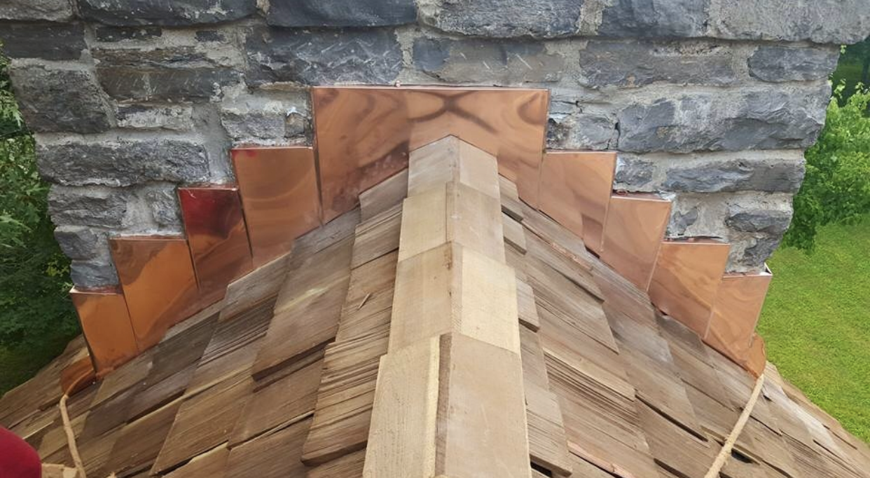Custom copper chimney flashing by RickJohn Roofing