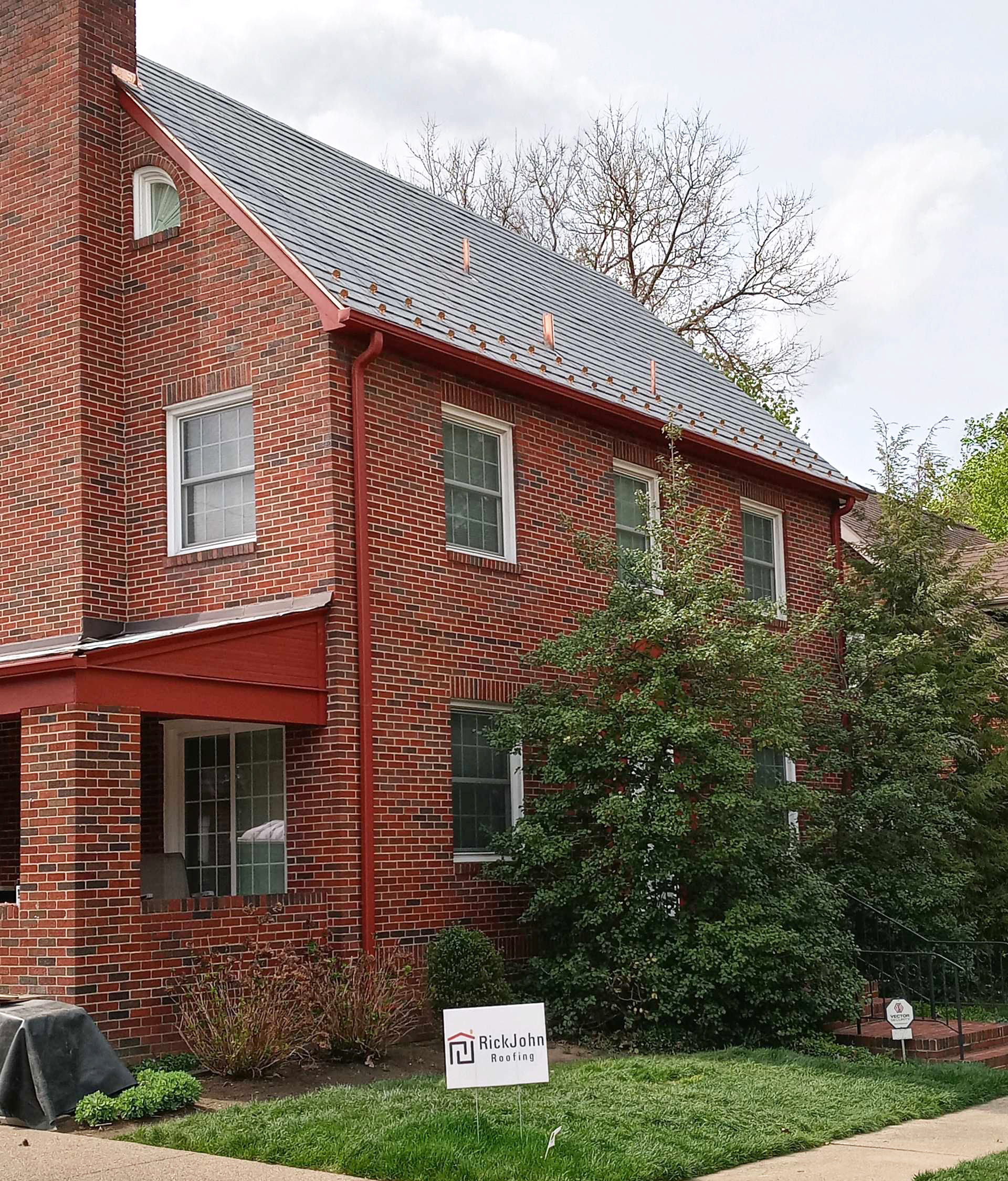 Hand-laid slate roofing by RickJohn Roofing